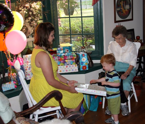 Sam helps Meg unwrap presents